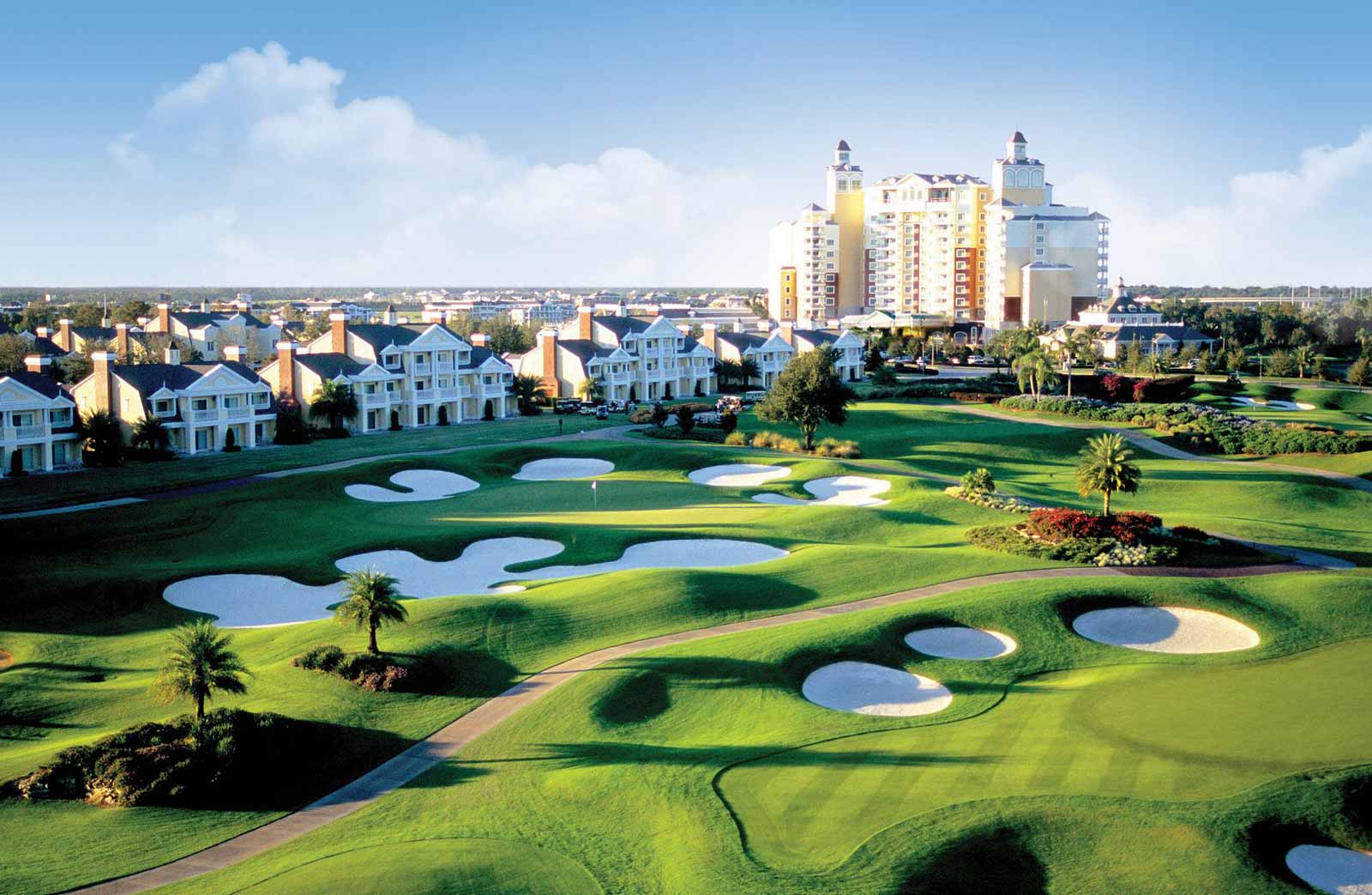 A birds-eye image of Reunion Resort in Reunion, Florida, taken from across the golf course including the Grand Hotel in the distance.